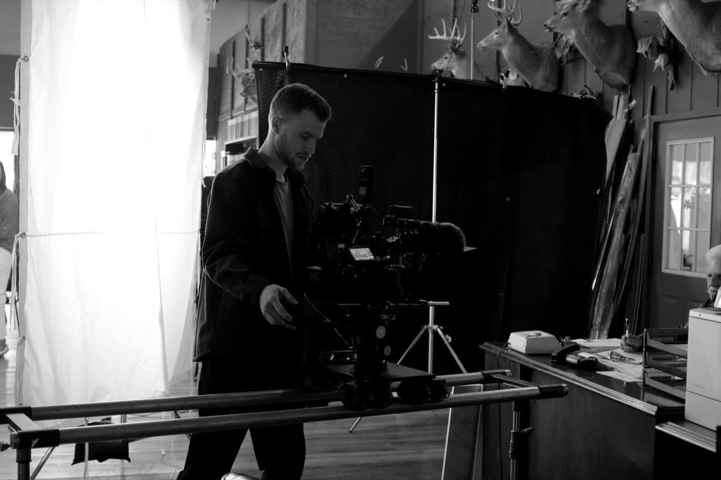 Griffin Road Media crew on set running a camera dolly